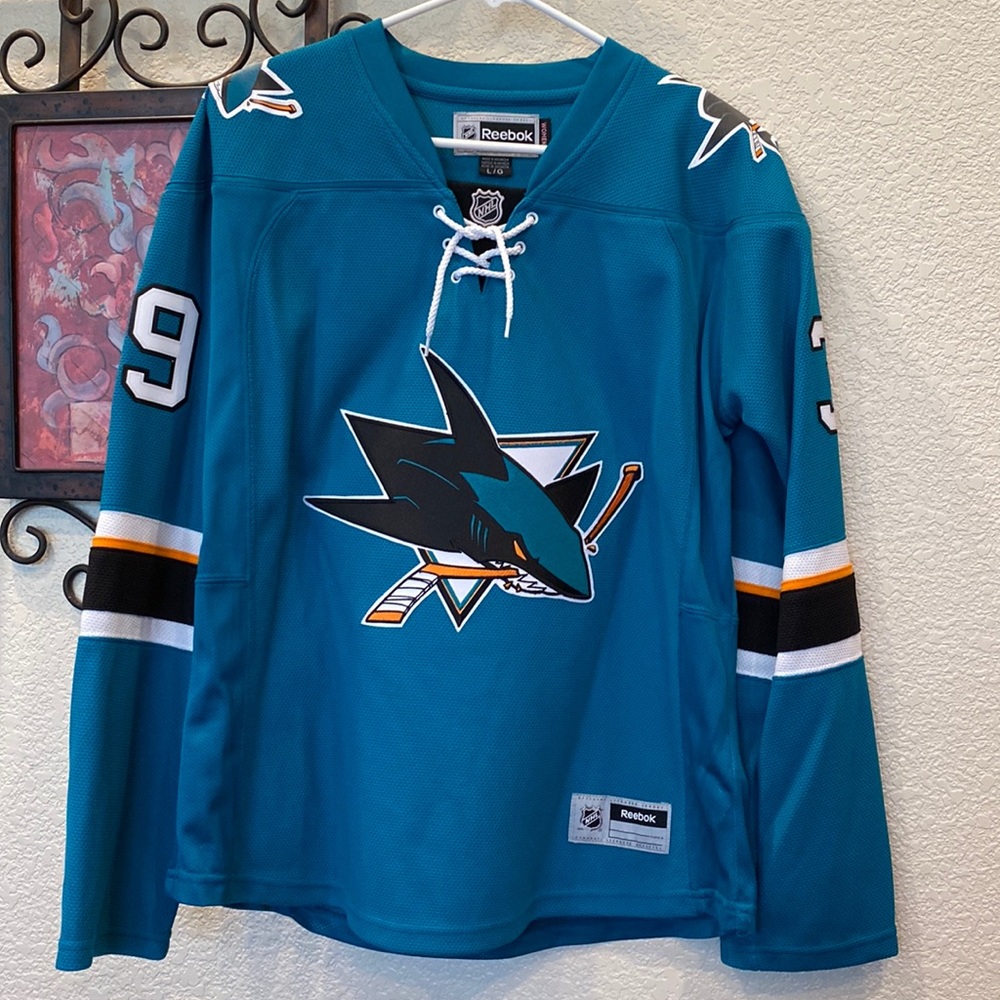 NWOT women’s Reebok Sharks Couture #39 LS Official NHL teal jersey.